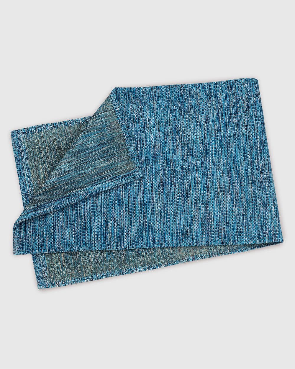 The back of the Yogi Classic 7MM in Arctic, corner folded to show the natural rubber layer.