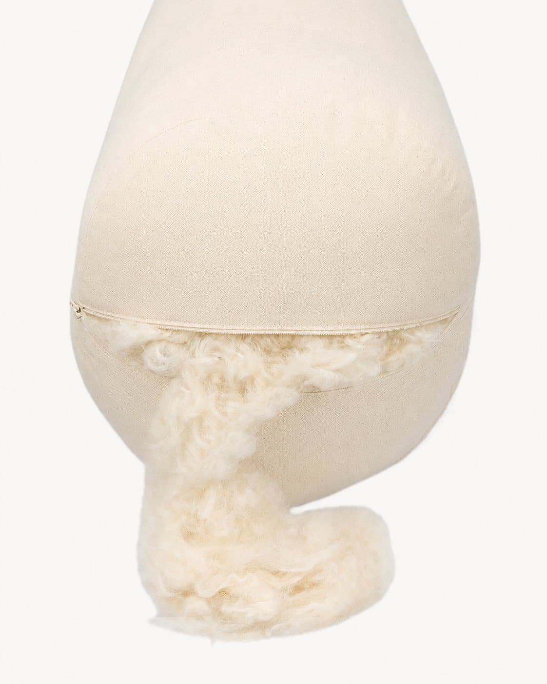 The Round Bolster with its cover off: the inner pillow, kapok spilling from the opening